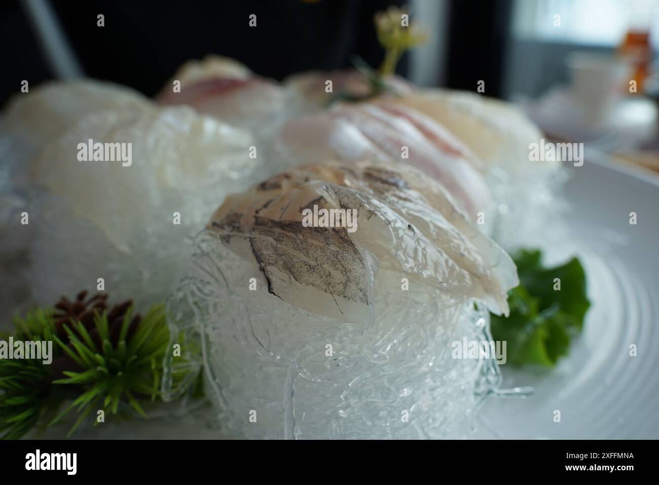 A table of fresh raw fish is served Stock Photo