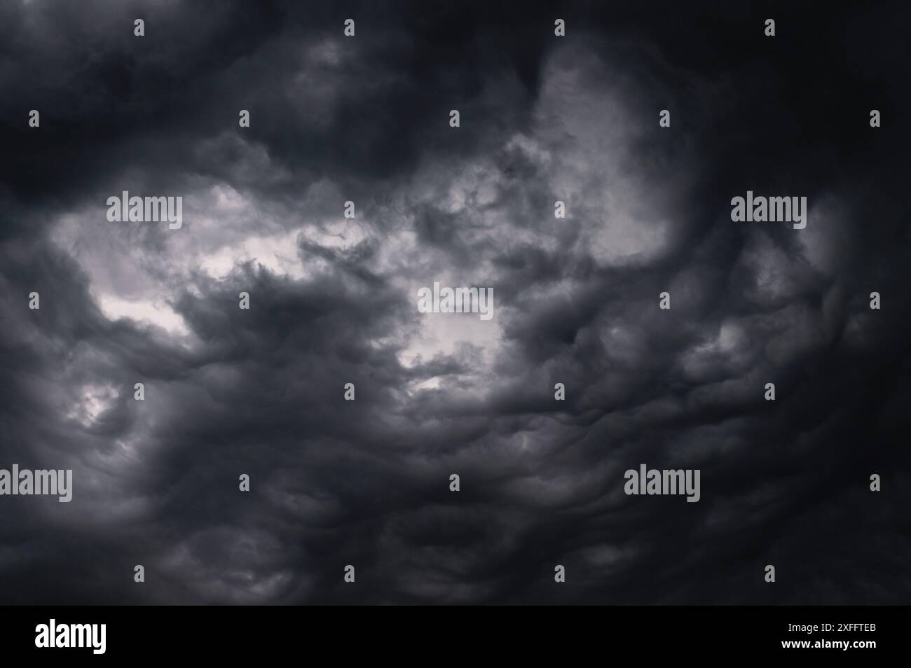 Dark storm clouds gathering in the sky creating a dramatic and moody ...