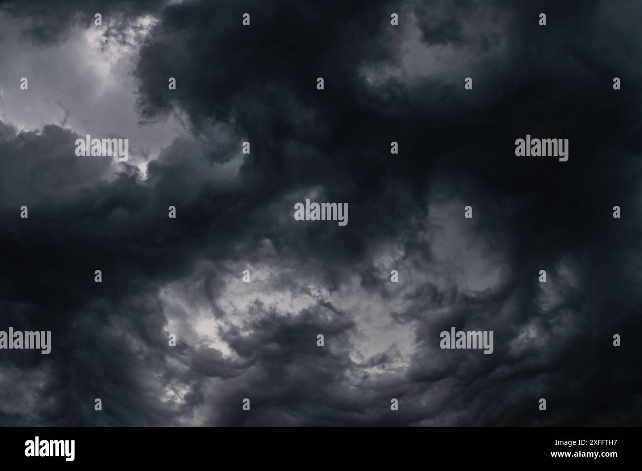Dark storm clouds gathering in the sky creating a dramatic and moody ...