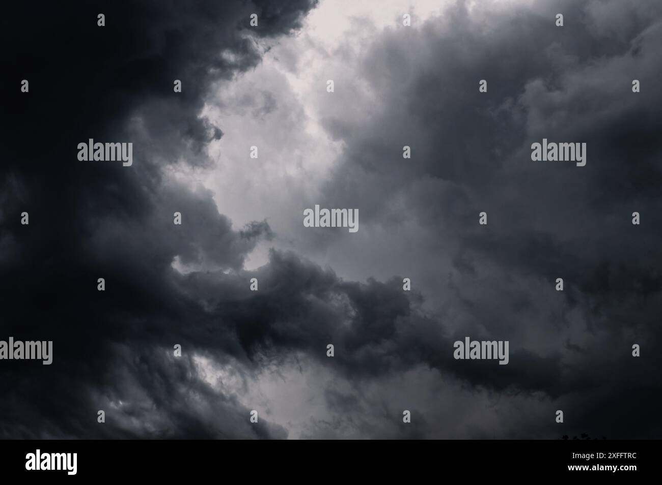 Dark storm clouds gathering in the sky creating a dramatic and moody ...