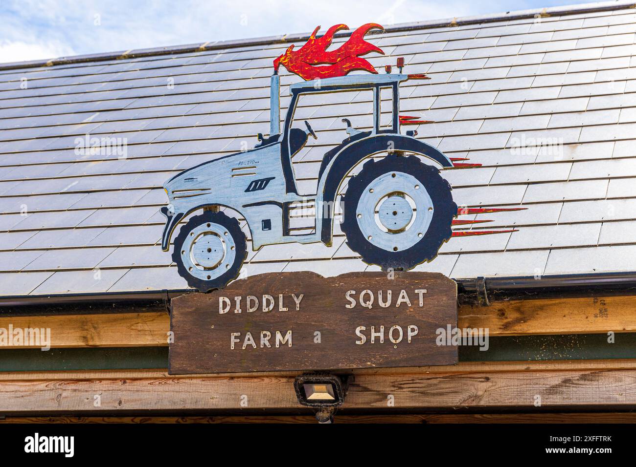 A representation of Jeremy Clarkson's Lamborghini tractor over his Diddly Squat Farm Shop (opened in 2020) near Chadlington, Chipping Norton, Oxfordsh Stock Photo