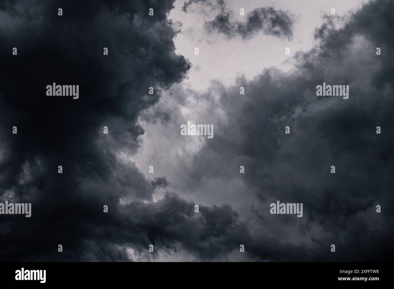 Dark storm clouds gathering in the sky creating a dramatic and moody ...
