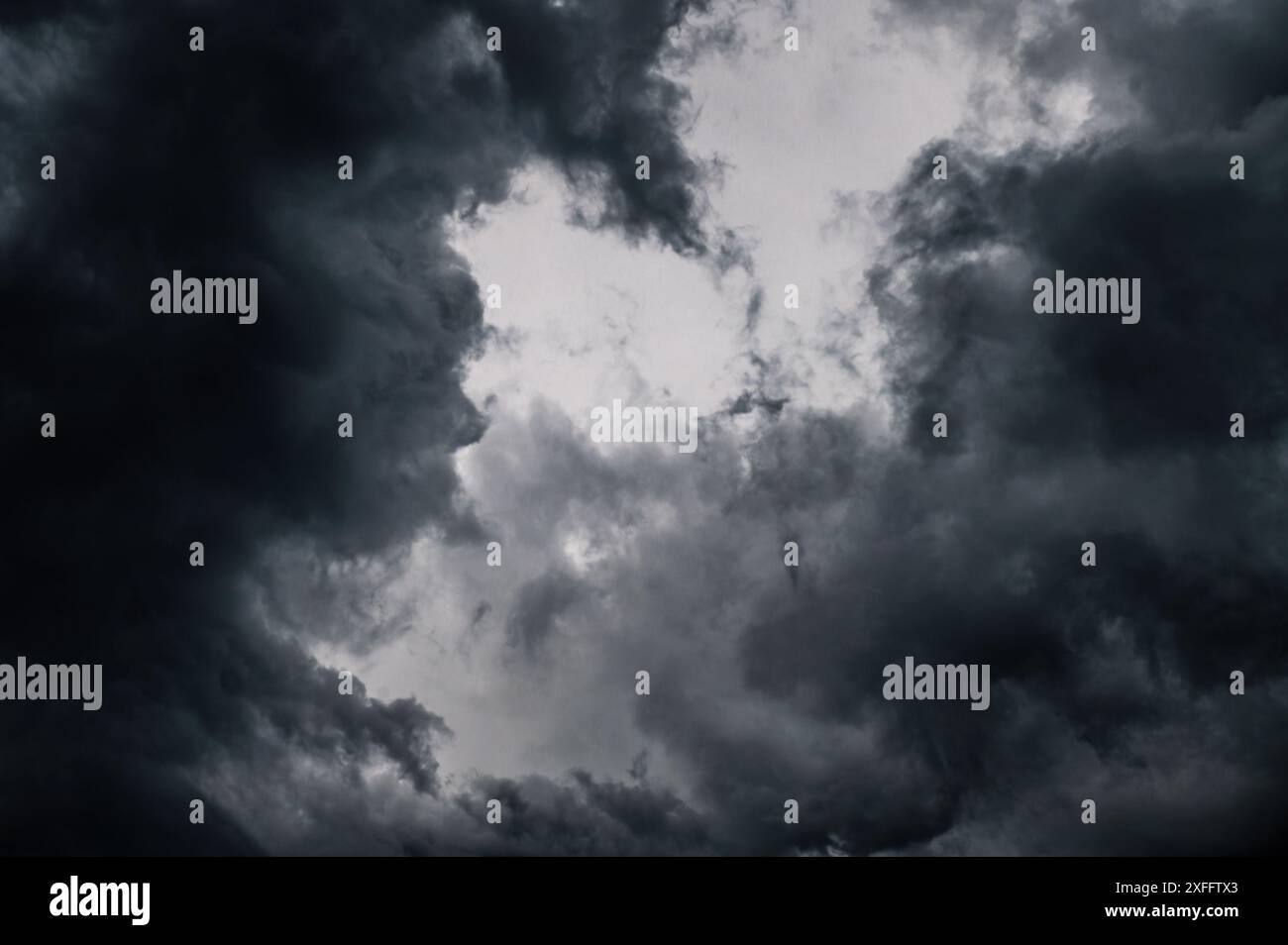 Dark storm clouds gathering in the sky creating a dramatic and moody ...
