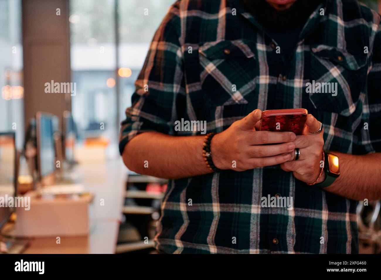 Close Up Young Bearded Programmer Using Smartphone in Office Stock Photo