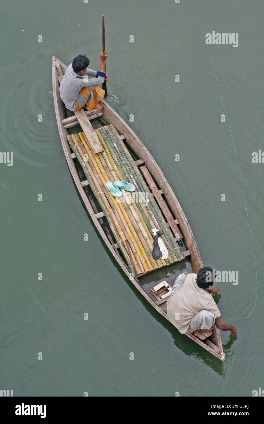 Slum dwellers of low-lying area at Adabar Friday catching fish as water ...