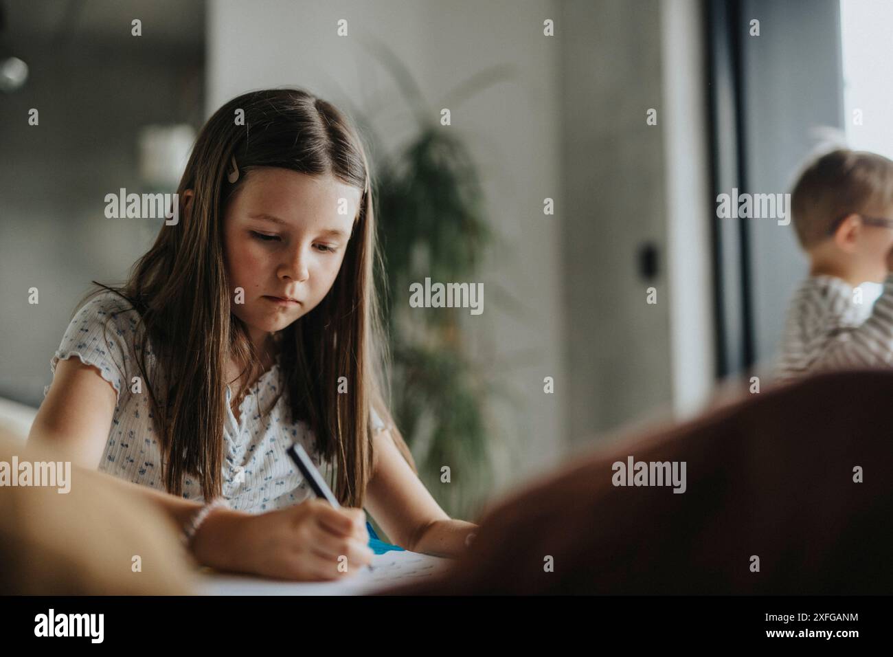 Girl writing book hi-res stock photography and images - Alamy