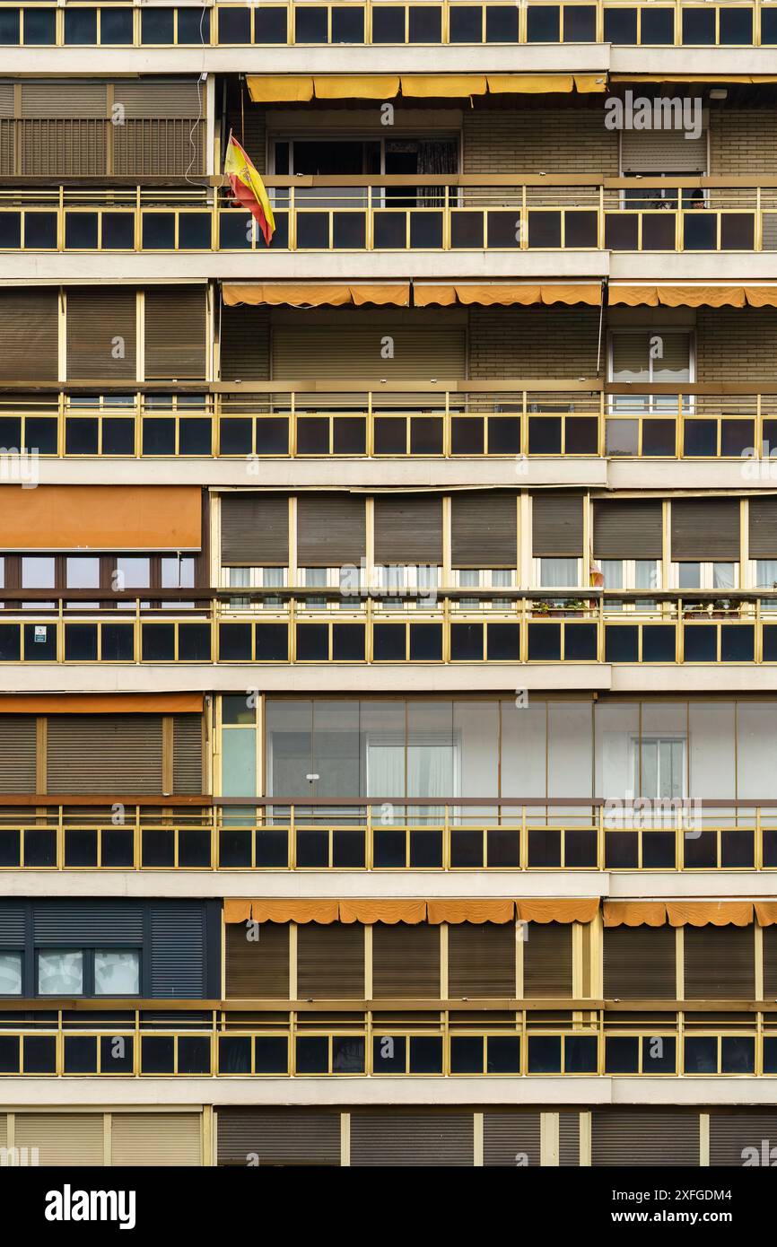 Windows and balconies of an old high-rise residential building in Spain ...