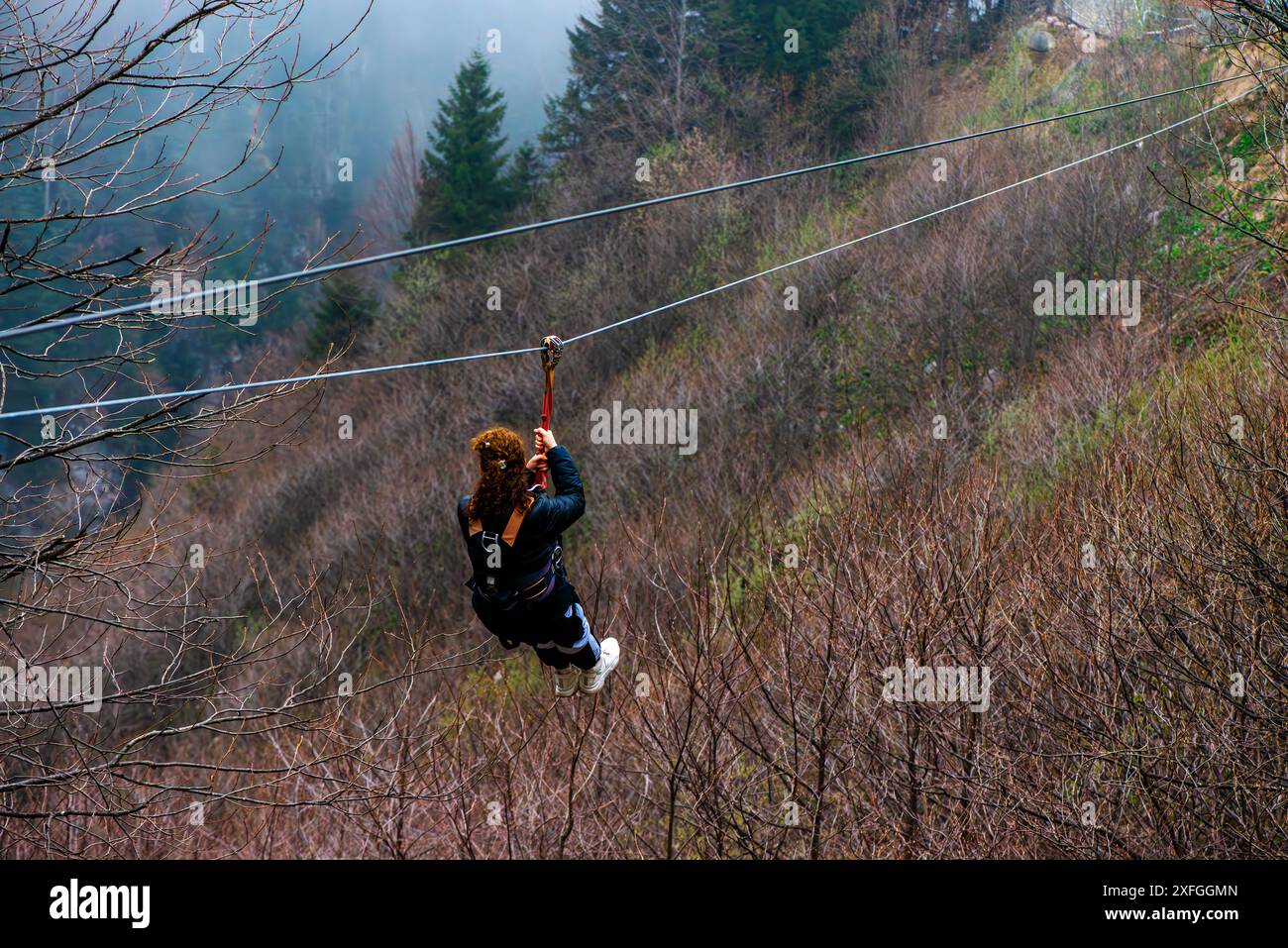 A picturesque moment capturing a woman sliding gracefully with her ...