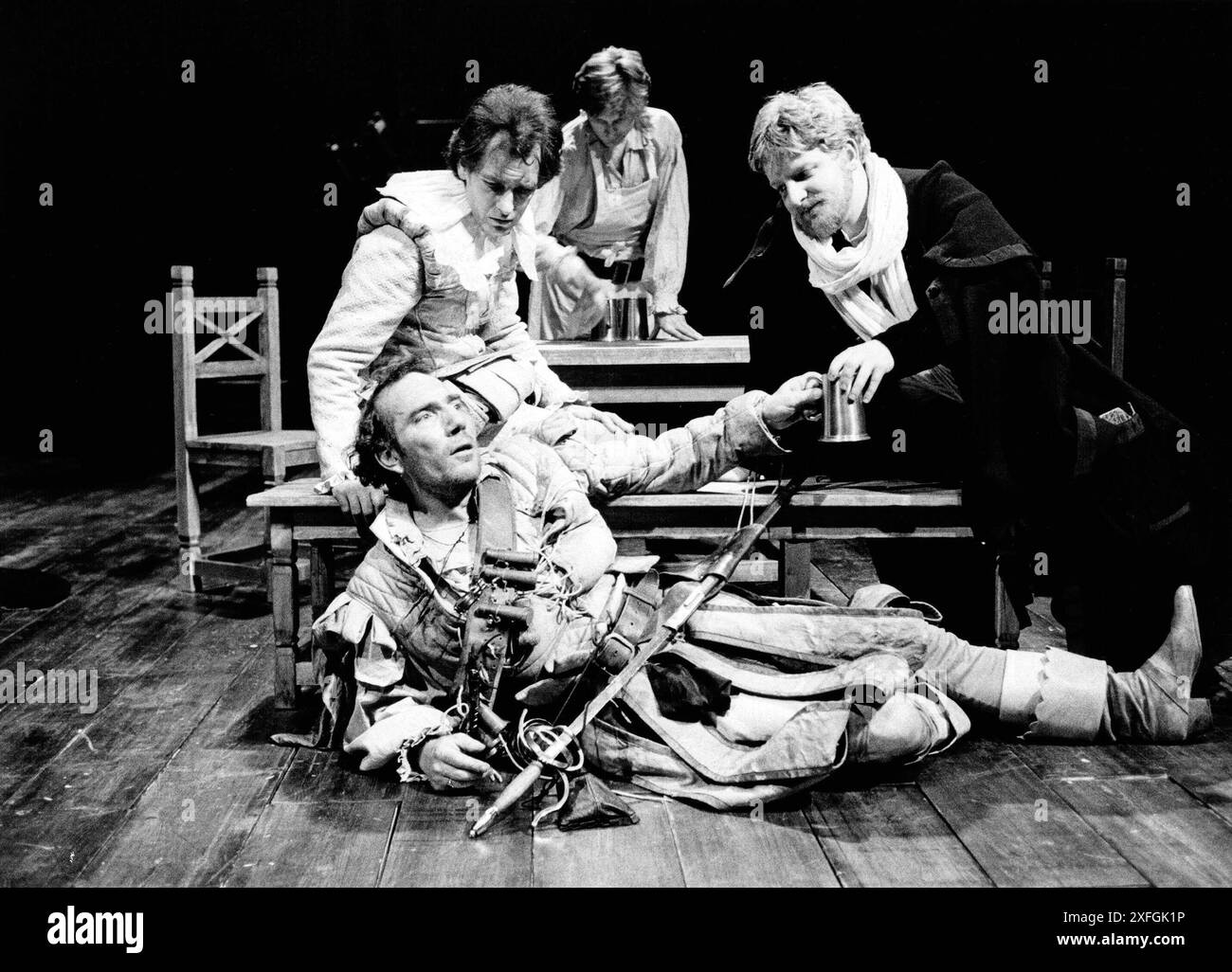 front, l-r: Pete Postlethwaite (Captain Bobadill), Paul Greenwood (Master Stephen), Simon Russell Beale (Ed Kno'well) in EVERY MAN IN HIS HUMOUR by Ben Jonson at the Royal Shakespeare Company (RSC), Swan Theatre, Stratford-upon-Avon 21/05/1986  design: Sue Blane  lighting: Wayne Dowdeswell  director: John Caird Stock Photo