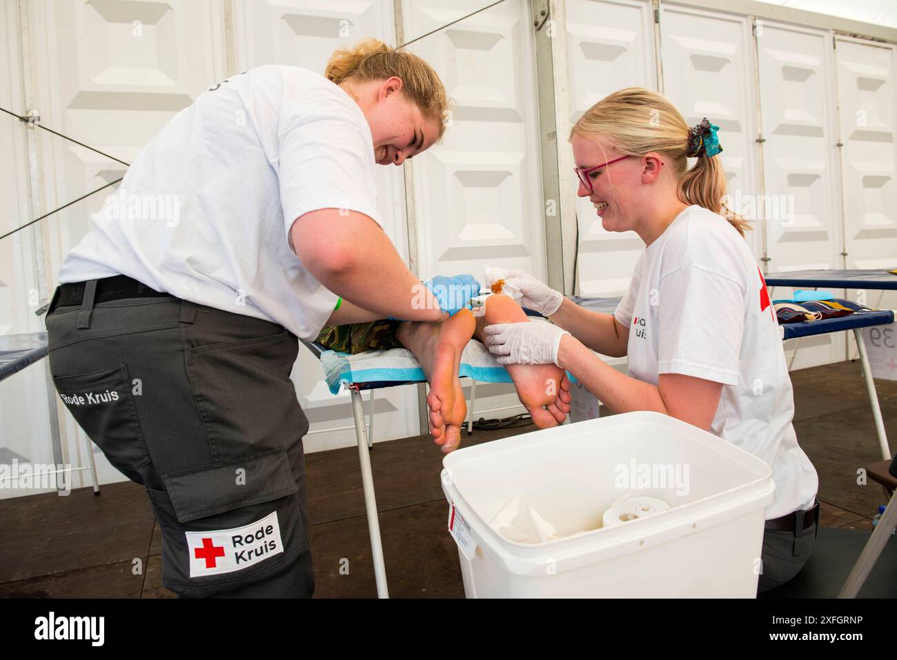Four Day March Nijmegen Red Cross medical staff taking care of blisters ...