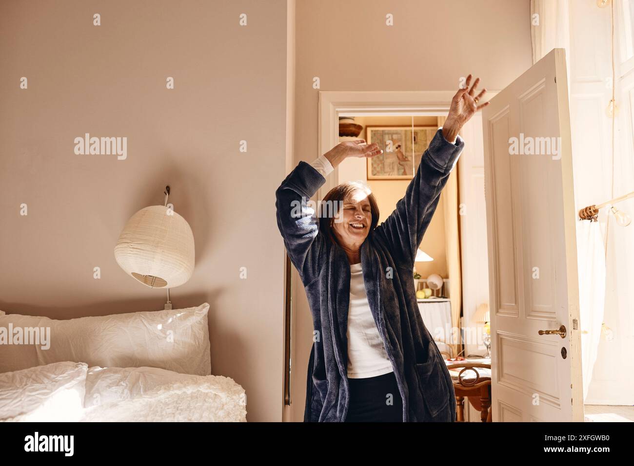 Senior woman arms outstretched hi-res stock photography and images - Alamy