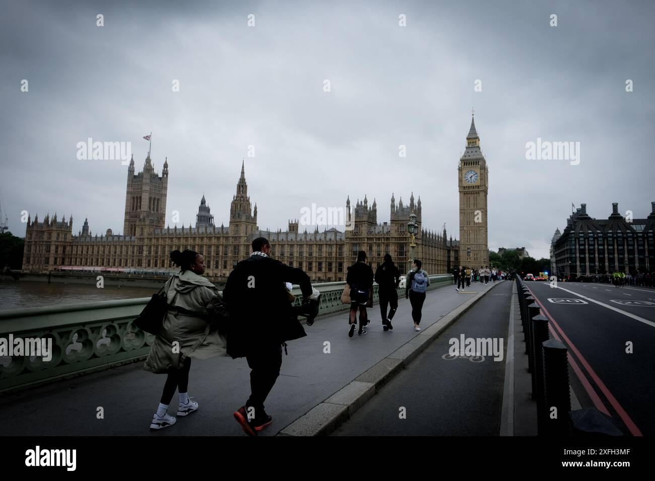 London, United Kingdom. 3rd July, 2024.  People walk wearing raincoats in central London.   Laura Gaggero/Alamy Live News Stock Photo