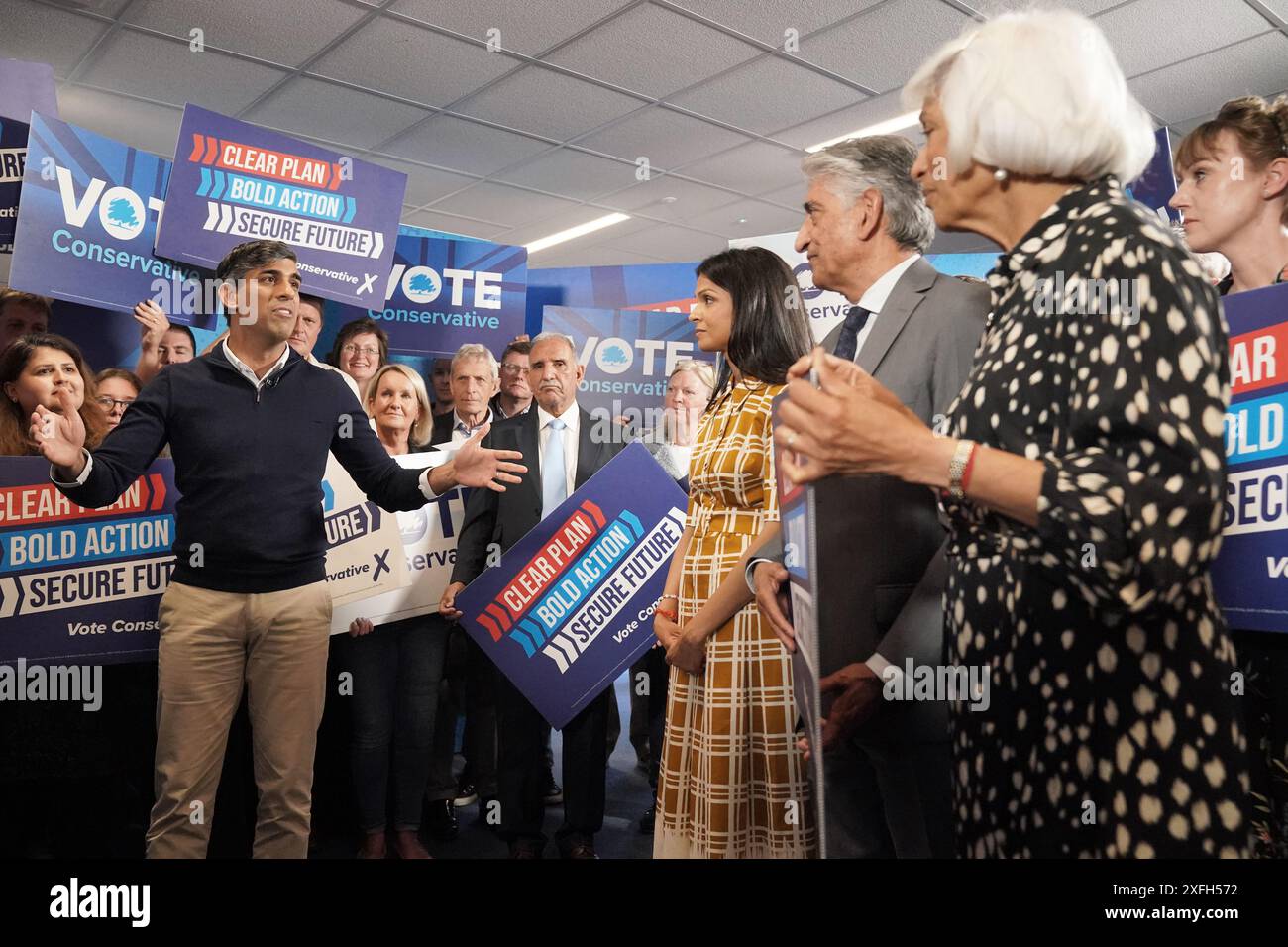 (front left-right) Prime Minister Rishi Sunak giving a speech, watched by his wife Akshata Murty and his parents Usha and Yashvir Sunak at Romsey Rugby Club, Hampshire, while on the General Election campaign trail. Picture date: Wednesday July 3, 2024. Stock Photo