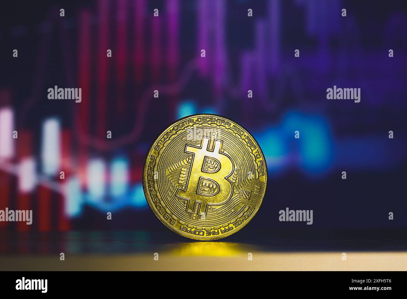 Paraguay. 3rd July, 2024. In this photo illustration, a Bitcoin is seen on  the table with a stock market graph in the background. (Credit Image: ©  Jaque Silva/SOPA Images via ZUMA Press