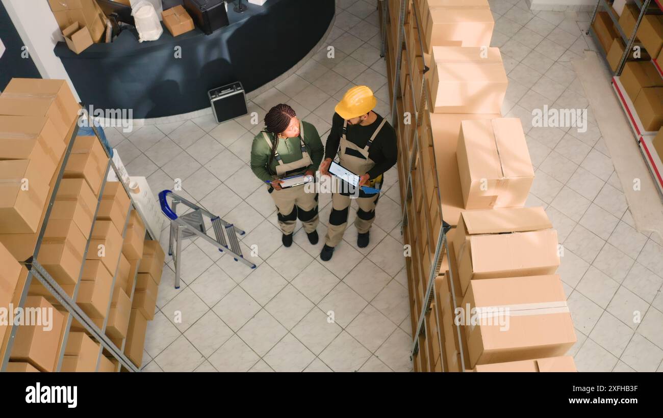 Group Inspecting Box Inspecting warehouse shelves woman hi-res stock photography and images ...
