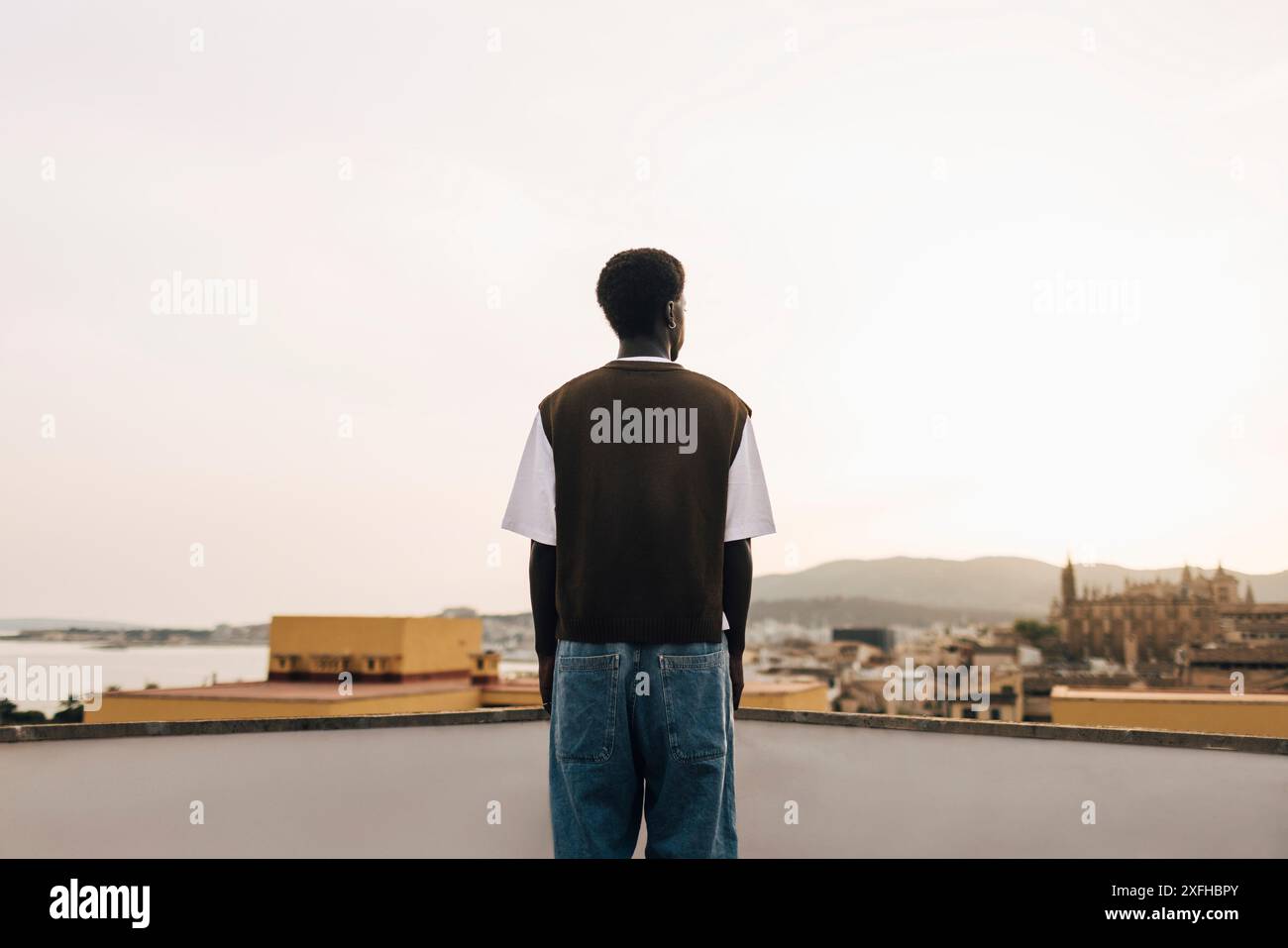 Rear view young african man hi-res stock photography and images - Alamy