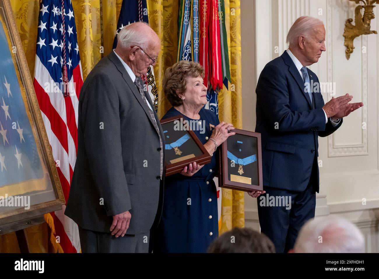 Washington, United States. 03rd July, 2024. U.S. President Joe Biden applauds Mr. Gerald Taylor, Great, Great Nephew of Private Philip G. Shadrach, and Mrs. Theresa Chandler, Great, Great Granddaughter of Private George D. Wilson, after presenting them the Posthumous Medal of Honor Recipient awards in a Ceremony in the East Room of the White House in Washington, DC on Wednesday, July 3, 2024. Photo by Ken Cedeno/UPI Credit: UPI/Alamy Live News Stock Photo