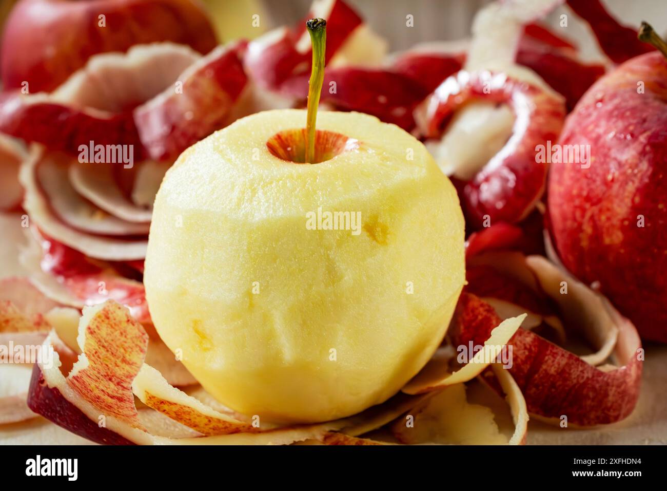 Preparing apple for a pie.  Peeling gala apples. Stock Photo