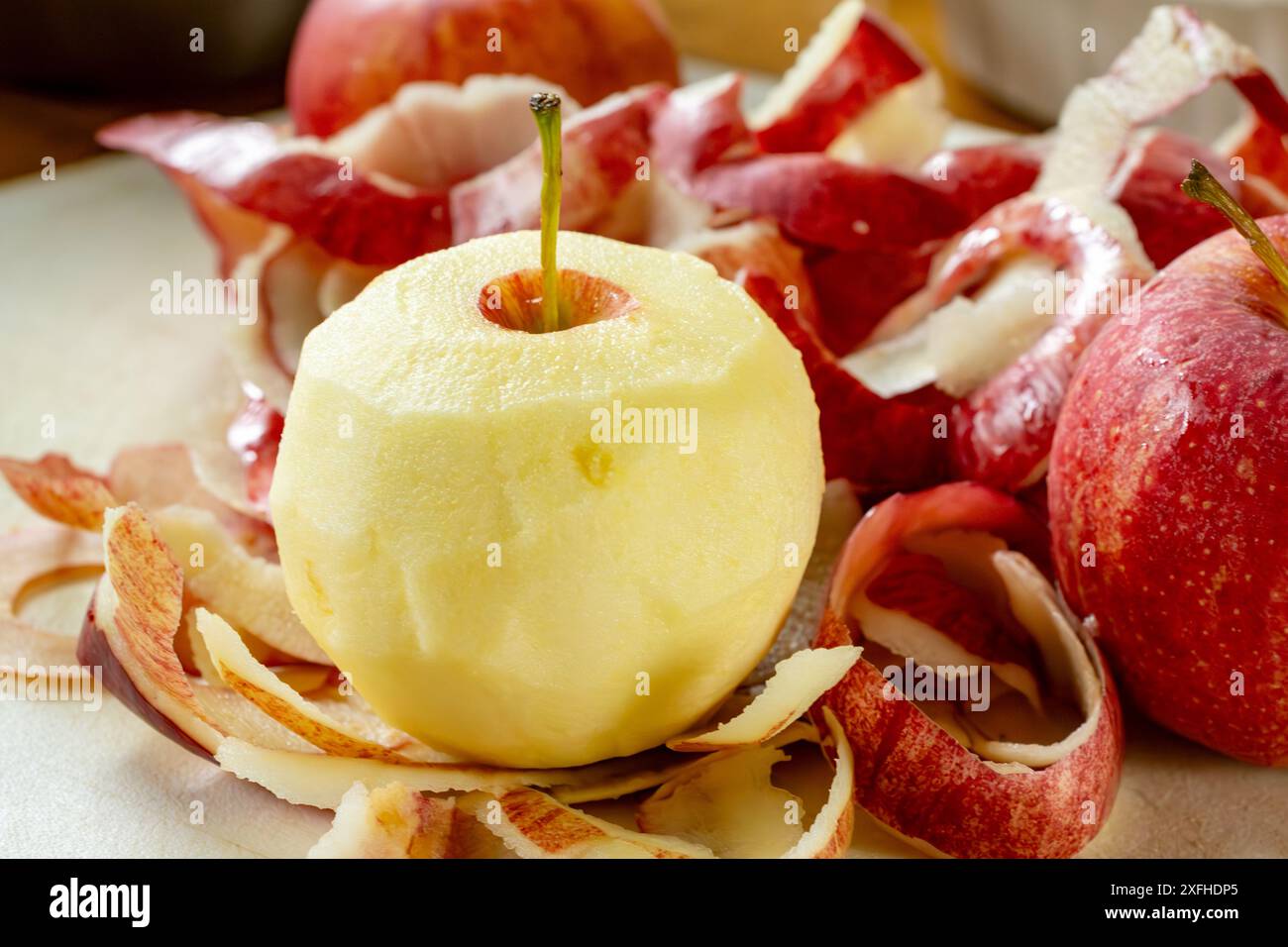 Preparing apple for a pie.  Peeling gala apples. Stock Photo