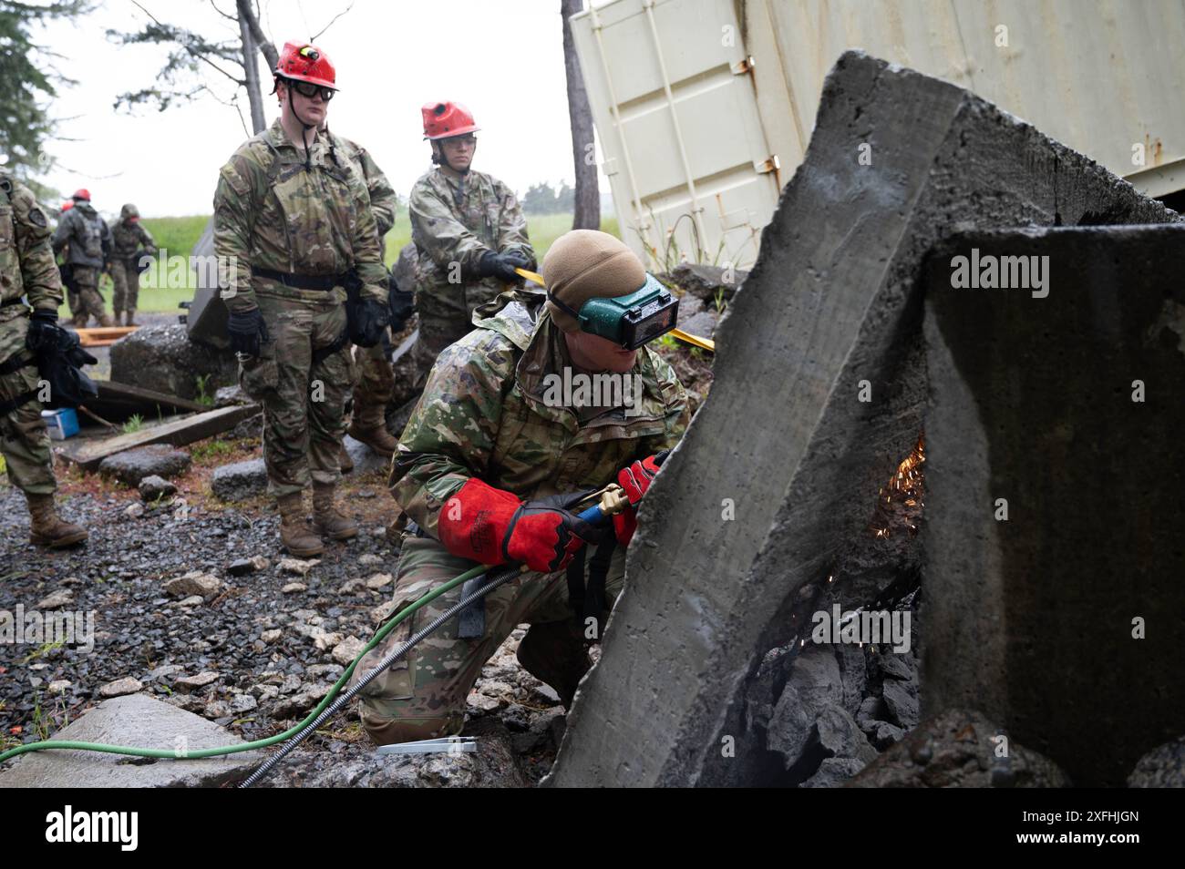 An Airman assigned to the 142nd Medical Group, Detachment 1 welds ...