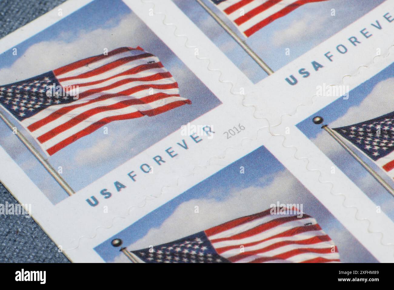 Lake Elsinore, CA, USA - July 3, 2024: Close up of four U.S.P.S. forever stamps Stock Photo