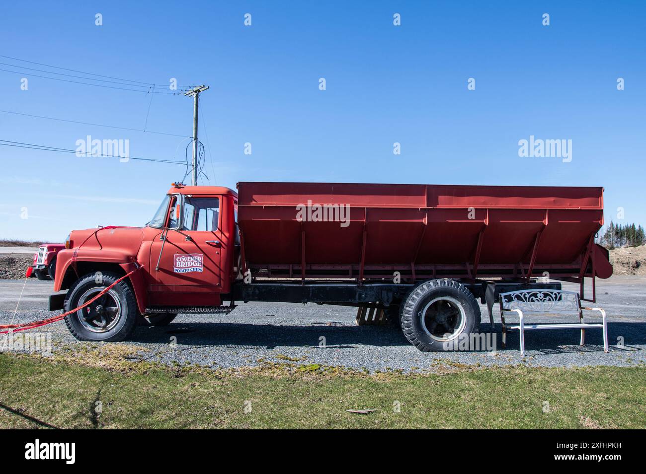 Red company truck parked at the Covered Bridge Potato Chip factory on ...