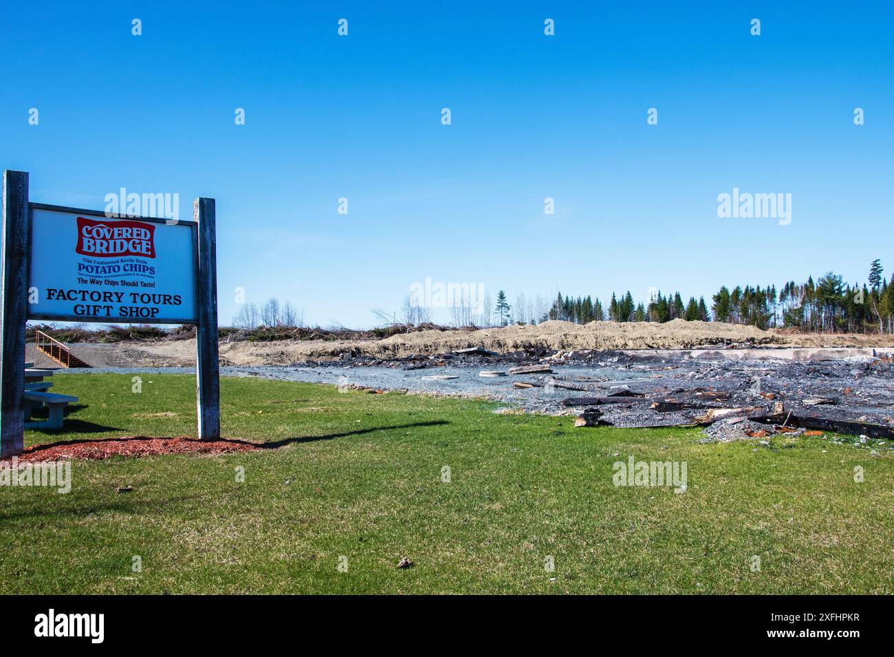 Covered Bridge Potato Chips sign with charred remains of factory on ...