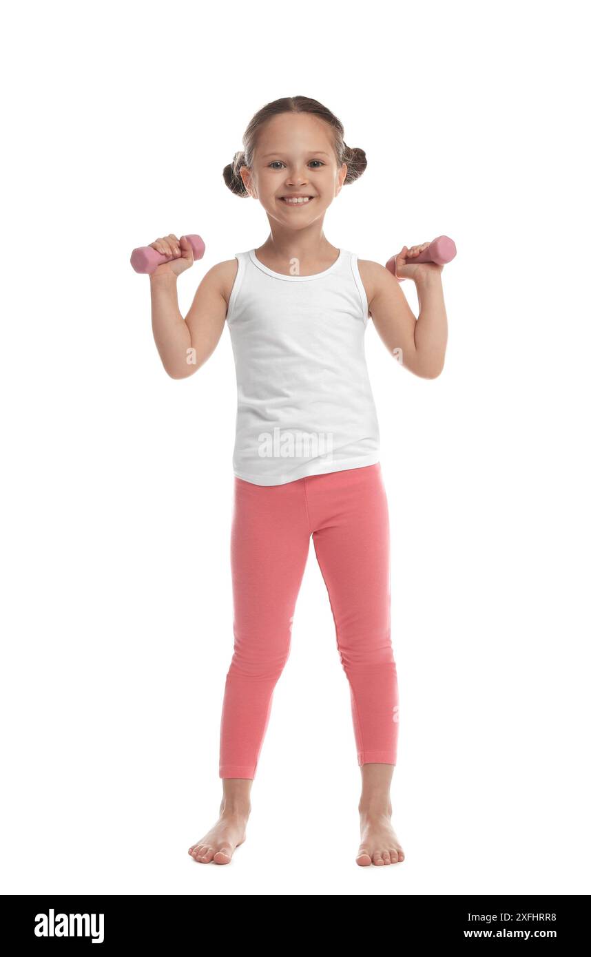 Cute little girl with dumbbells on white background Stock Photo - Alamy