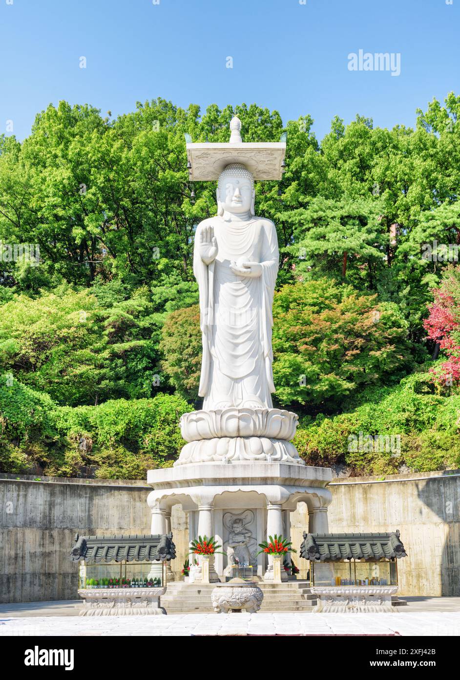 Beautiful view of Seoul skyline from Bongeunsa Temple at Gangnam District in Seoul, South Korea. Back view of Buddha statue. Stock Photo
