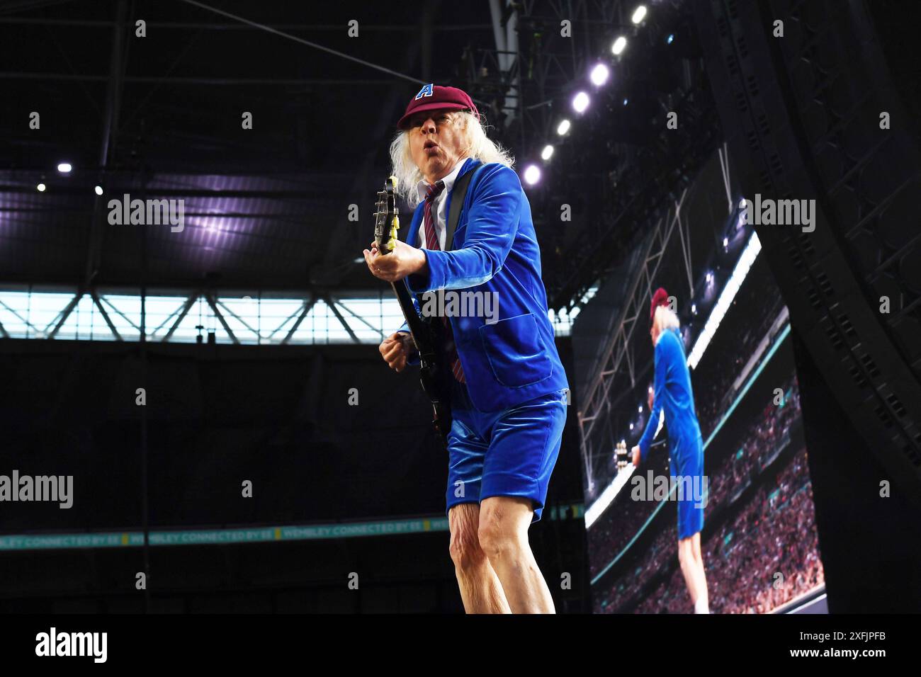 LONDON, ENGLAND - JULY 03: Angus Young of ‘AC/DC’ performing at Wembley ...