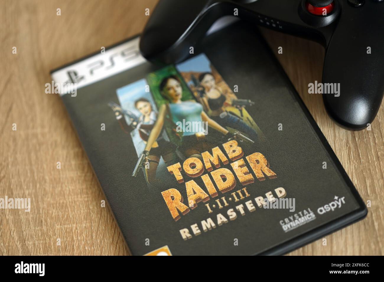 KYIV, UKRAINE JUNE 26, 2024 Tomb Raider 123 Remastered PS5 video game disc box for console