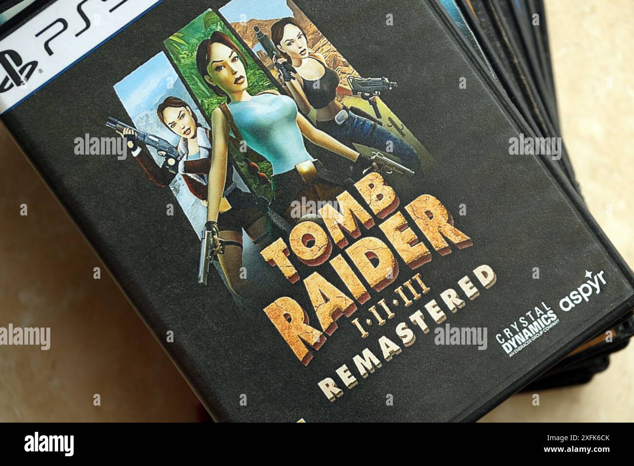 KYIV, UKRAINE JUNE 26, 2024 Tomb Raider 123 Remastered PS5 video game disc box for console