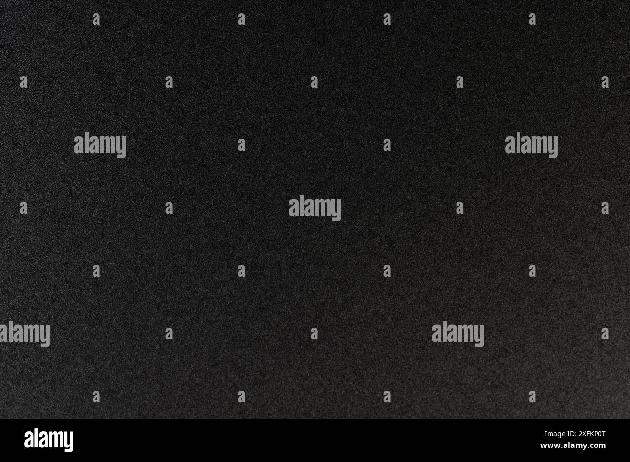 Grainy black mat pattern of flat plastic close up view Stock Photo