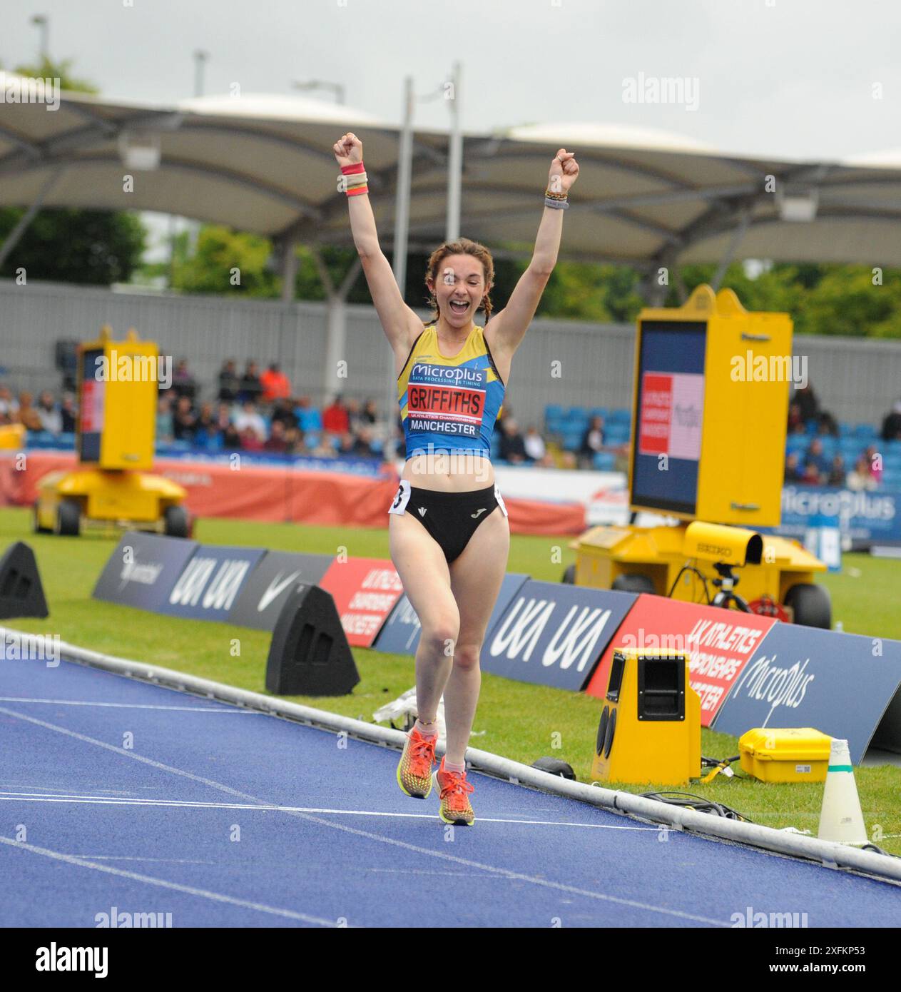 Gracie Griffiths crosses the finish line in first place in the 5000m ...
