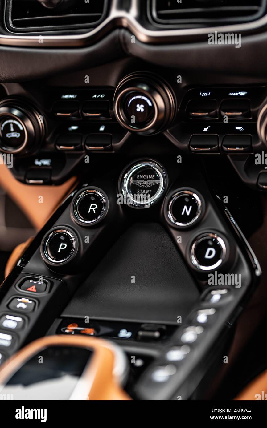 Aston Martin Vantage gear selector and engine start buttons, luxury sportscar center console closeup - High Resolution Stock Photo