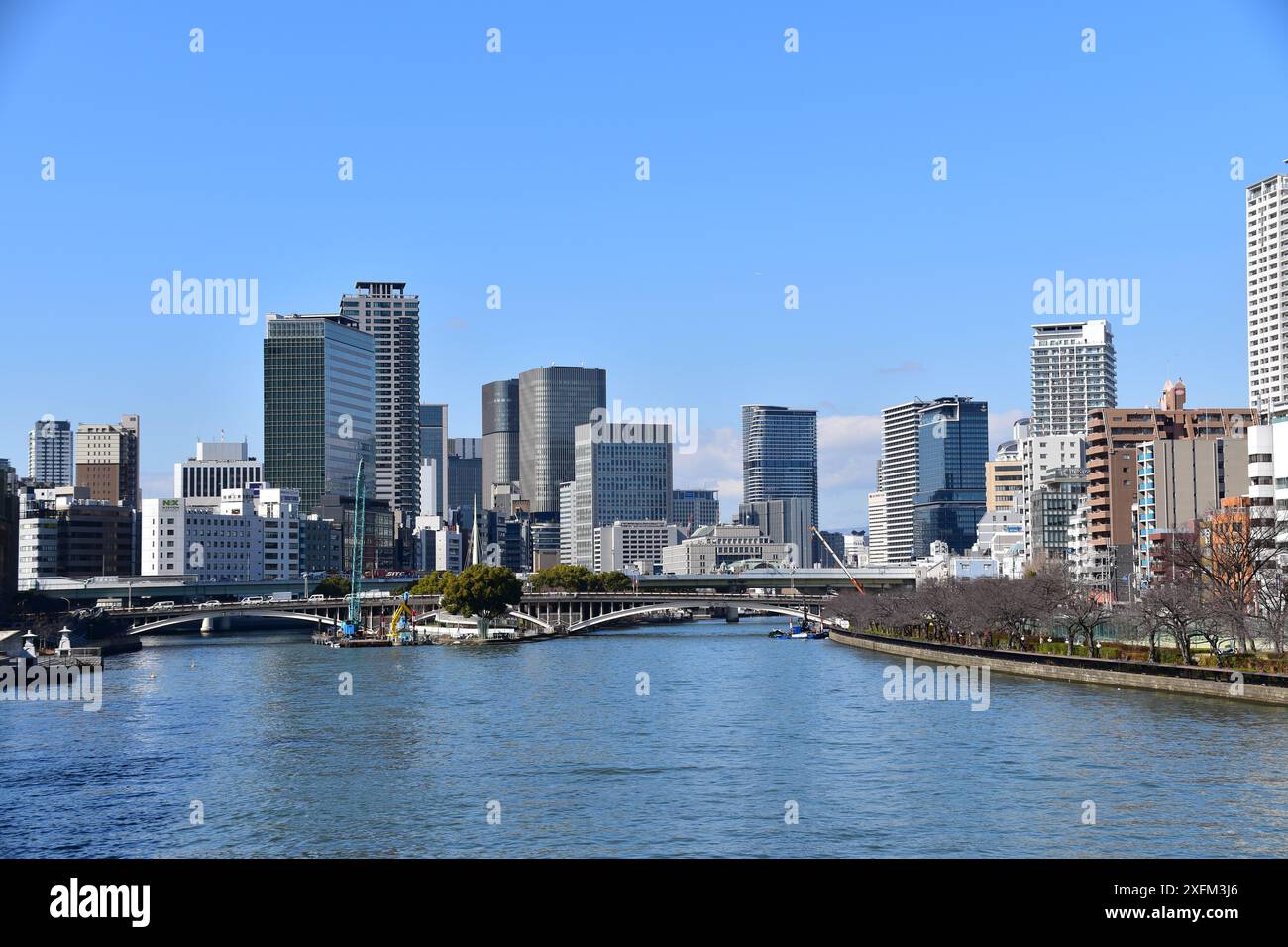 Cityscape of office buildings in downtown Osaka as seen across the O ...