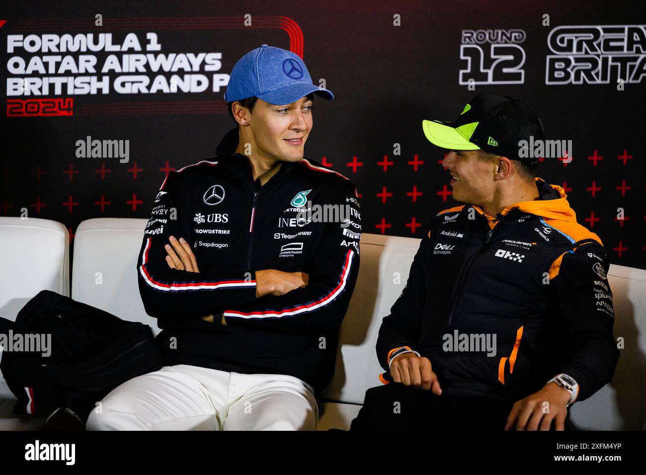 NORTHAMPTONSHIRE, UNITED KINGDOM. 04th Jul, 24. George Russell (Great Britain) of Mercedes-AMG PETRONAS F1 Team (l) and Lando Norris (Great Britain) of McLaren attended today’s Drivers’ Press Conference during Qatar Airways British Grand Prix 2024 at Sllverstone Circuit on Thursday, July 04, 2024 in NORTHAMPTONSHIRE, ENGLAND. Credit: Taka G Wu/Alamy Live News Stock Photo