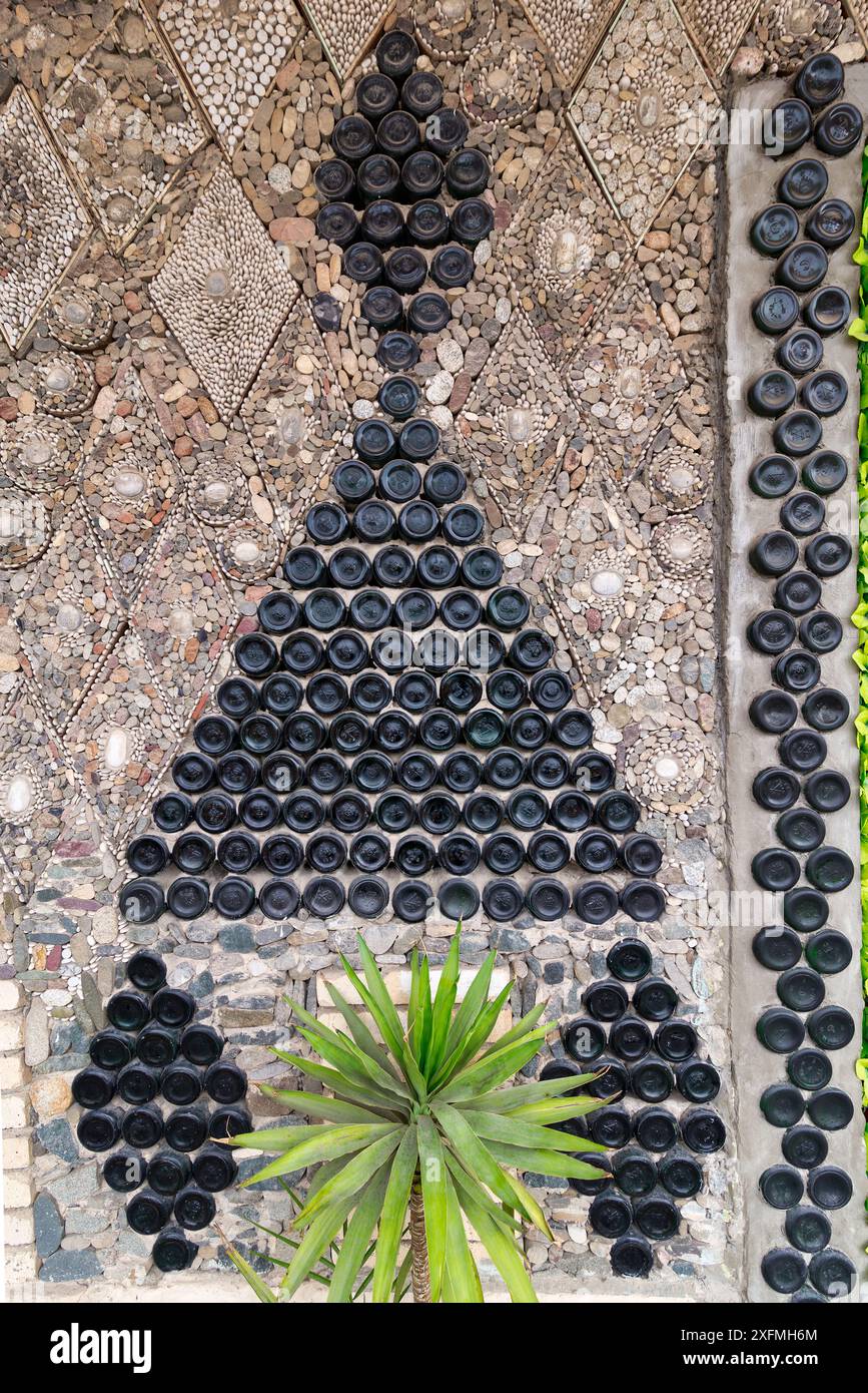 Glass bottle decoration on the Bottle House in Ganja, Azerbaijan - a triangular shape with smaller top triangle made from stacked bottles Stock Photo
