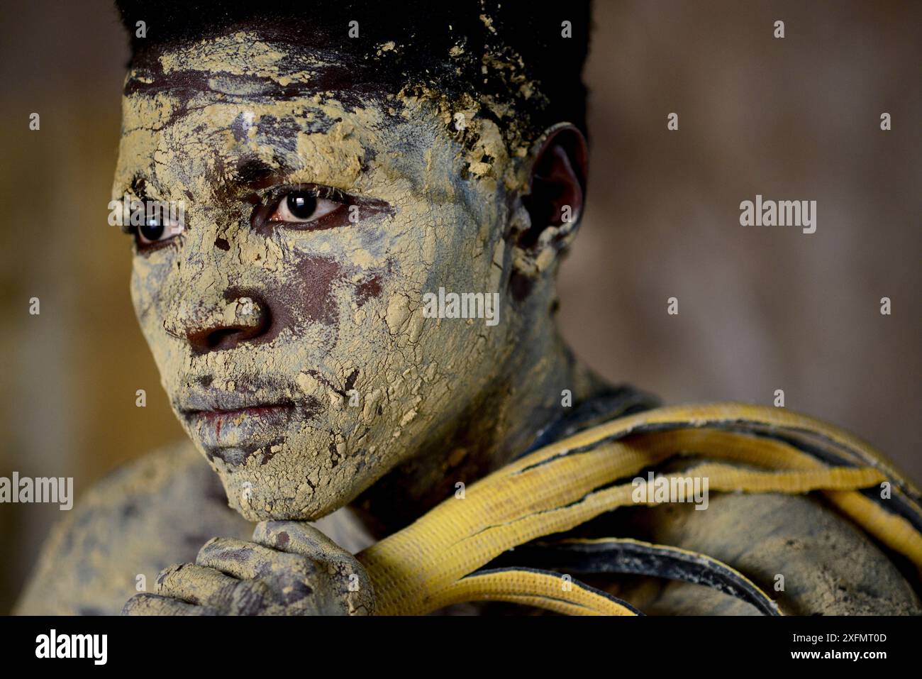 Portrait of man with skin coloured with sand for traditional dance, Bolama Island, Bijagos UNESCO Biosphere Reserve, Guinea Bissau, February 2015. Stock Photo