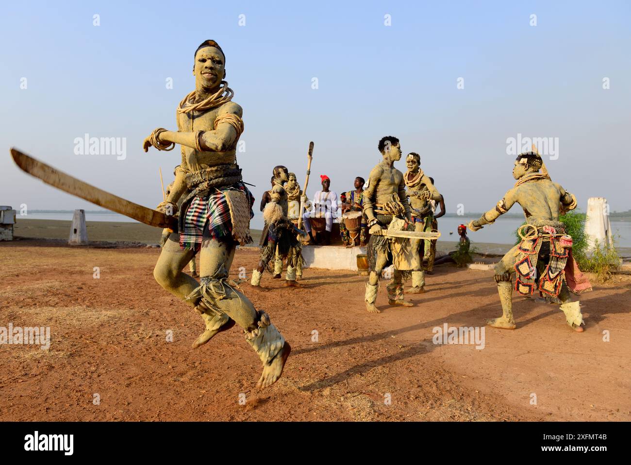 Men with skin coloured with sand participating in traditional dance, Bolama Island, Bijagos UNESCO Biosphere Reserve, Guinea Bissau, February 2015. Stock Photo