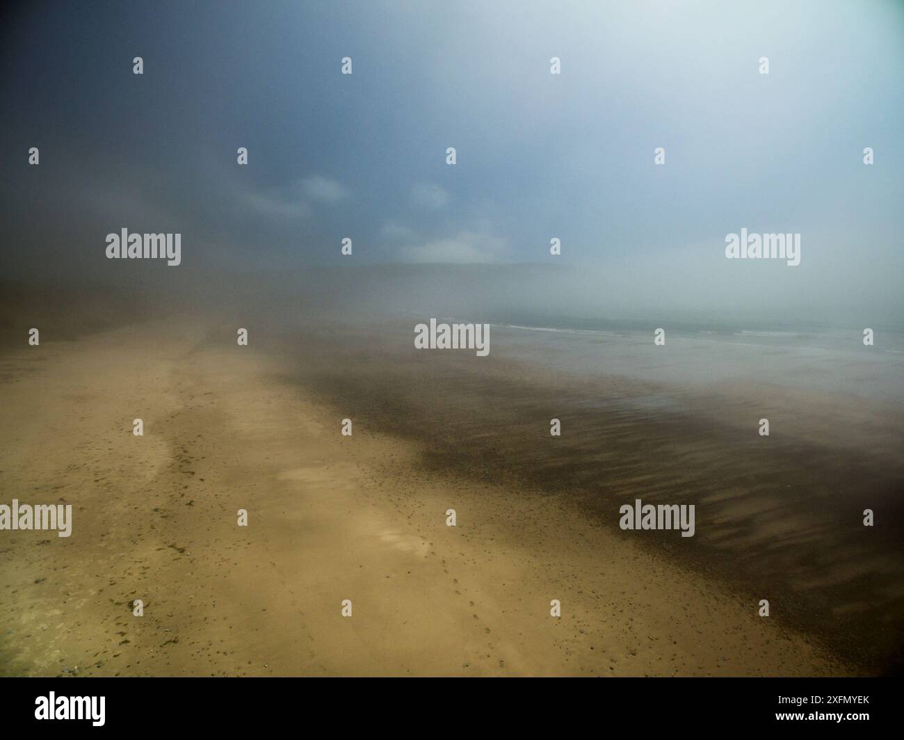 Beach with mist during warm spell, Hells Mouth, Porth Neigwl, Abersoch, Gwynedd, Wales, UK, July 2016. Stock Photo