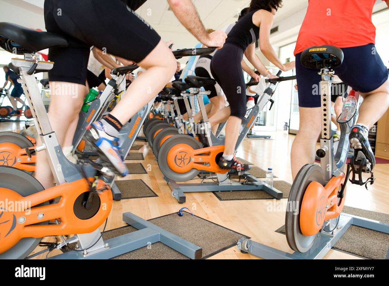 Spinning, training program for cardiovascular work and toning up in exercise bicycle Stock Photo