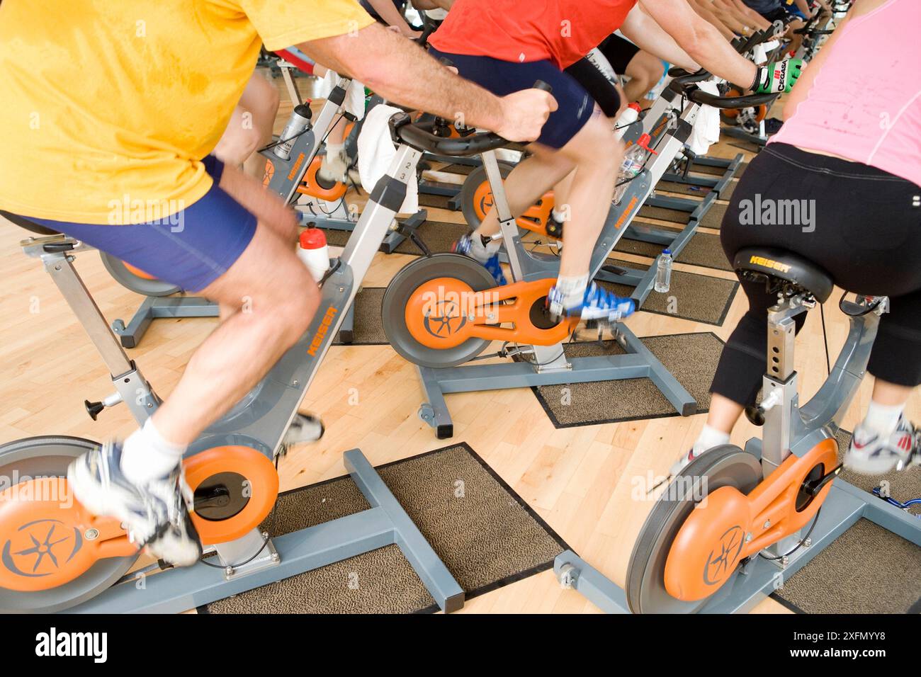Spinning, training program for cardiovascular work and toning up in exercise bicycle Stock Photo