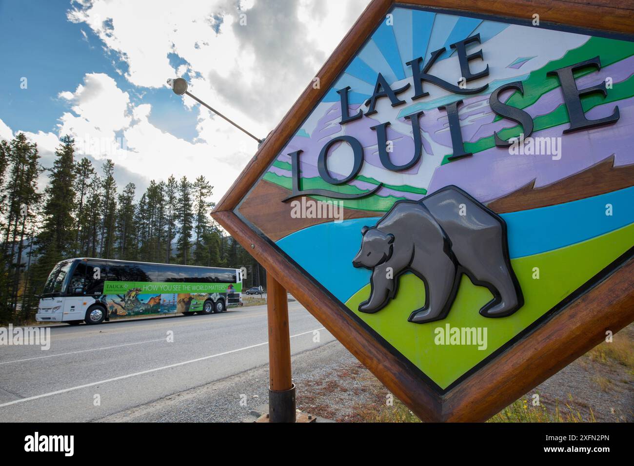 Location sign for Lake Louise featuring a grizzly bear, Lake Louise, Banff National Park, Alberta, Canada, June Stock Photo