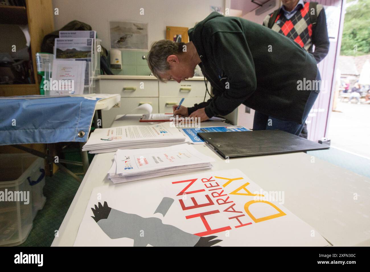 People signing a petition calling for a state regulated system of game bird hunting on grouse shooting estates. Hen Harrier Day, Loch Leven, Kinross, Scotland, UK, August 2016. Stock Photo