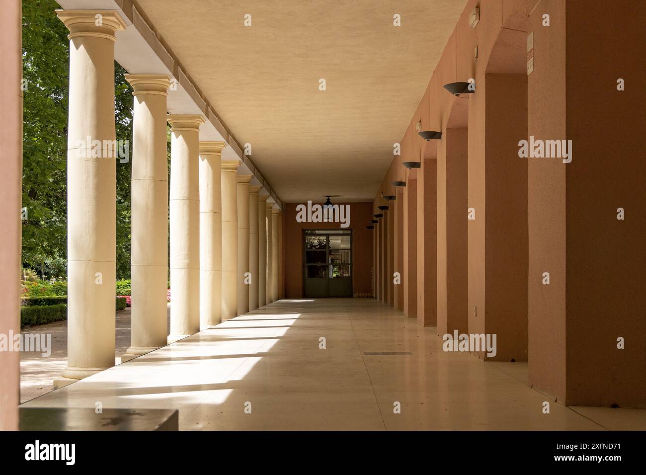 Vanishing point in a small courtyard of columns in a park in Madrid ...