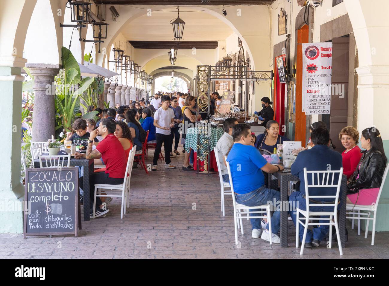 Mexico cafe; Tlaxcala street scene, people eating and drinking in a