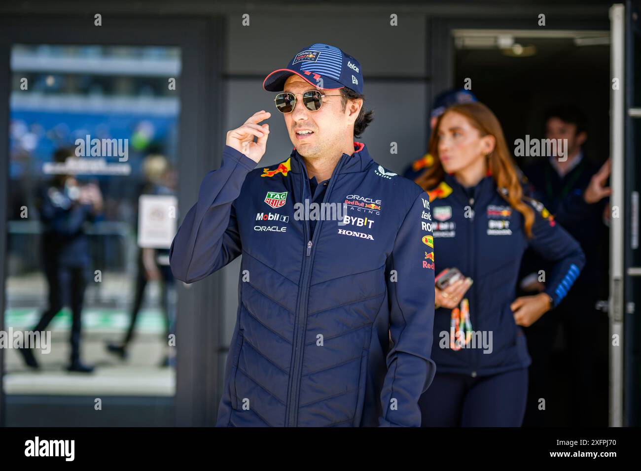 NORTHAMPTONSHIRE, UNITED KINGDOM. 04th Jul, 24. Sergio Perez (Mexico) of Red Bull Racing walks out prior to the Formula 1 Pit Lane Walk on Thursday during Qatar Airways British Grand Prix 2024 at Silverstone Circuit on Thursday, July 04, 2024 in NORTHAMPTONSHIRE, ENGLAND. Credit: Taka G Wu/Alamy Live News Stock Photo