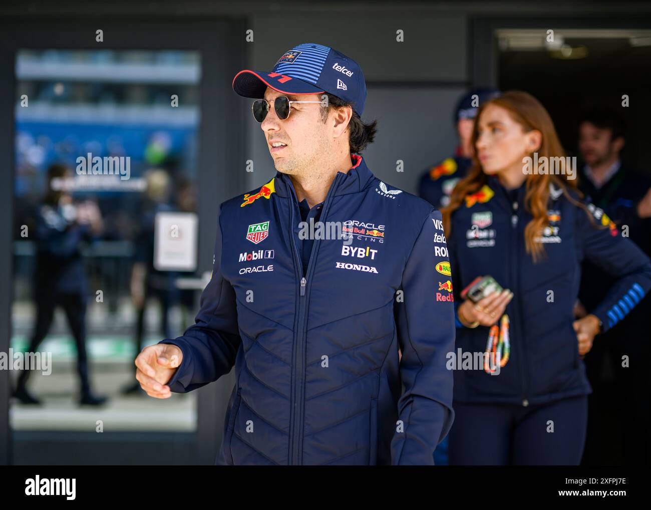 NORTHAMPTONSHIRE, UNITED KINGDOM. 04th Jul, 24. Sergio Perez (Mexico) of Red Bull Racing walks out prior to the Formula 1 Pit Lane Walk on Thursday during Qatar Airways British Grand Prix 2024 at Silverstone Circuit on Thursday, July 04, 2024 in NORTHAMPTONSHIRE, ENGLAND. Credit: Taka G Wu/Alamy Live News Stock Photo