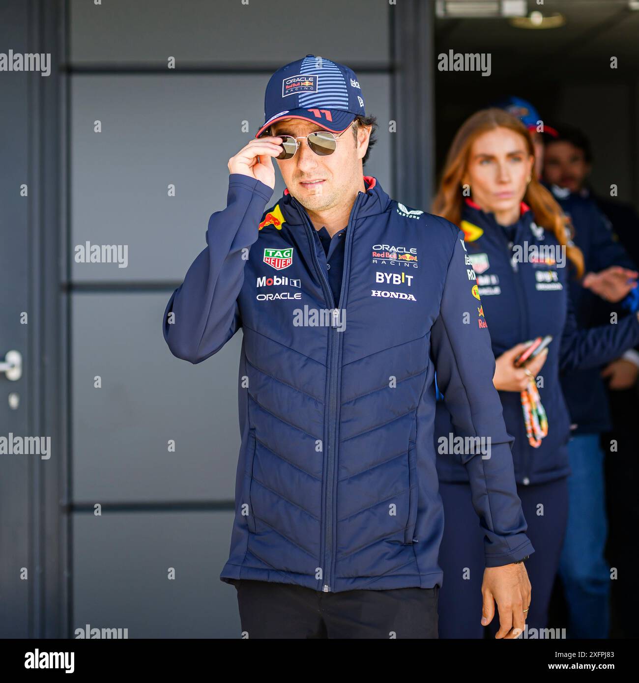 NORTHAMPTONSHIRE, UNITED KINGDOM. 04th Jul, 24. Sergio Perez (Mexico) of Red Bull Racing walks out prior to the Formula 1 Pit Lane Walk on Thursday during Qatar Airways British Grand Prix 2024 at Silverstone Circuit on Thursday, July 04, 2024 in NORTHAMPTONSHIRE, ENGLAND. Credit: Taka G Wu/Alamy Live News Stock Photo